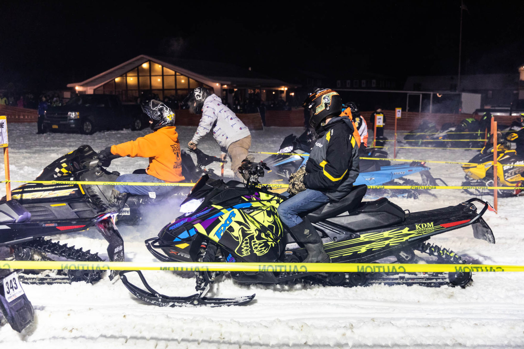 Snowmobile races heat up the night